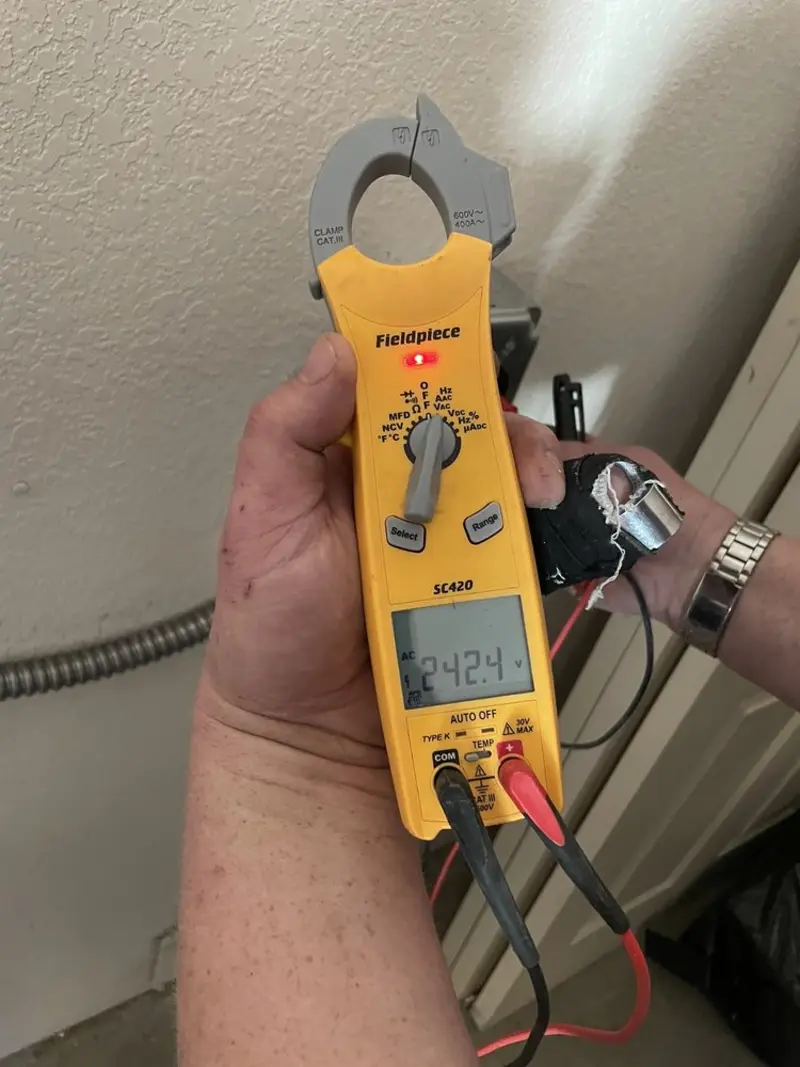 Voltage testing with clamp meter during Electrical Installation Services in Lecanto
